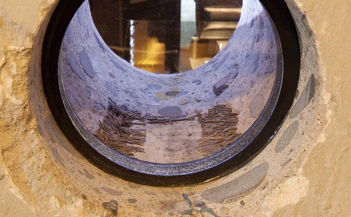 Truth hole showing shredded belts and debris
